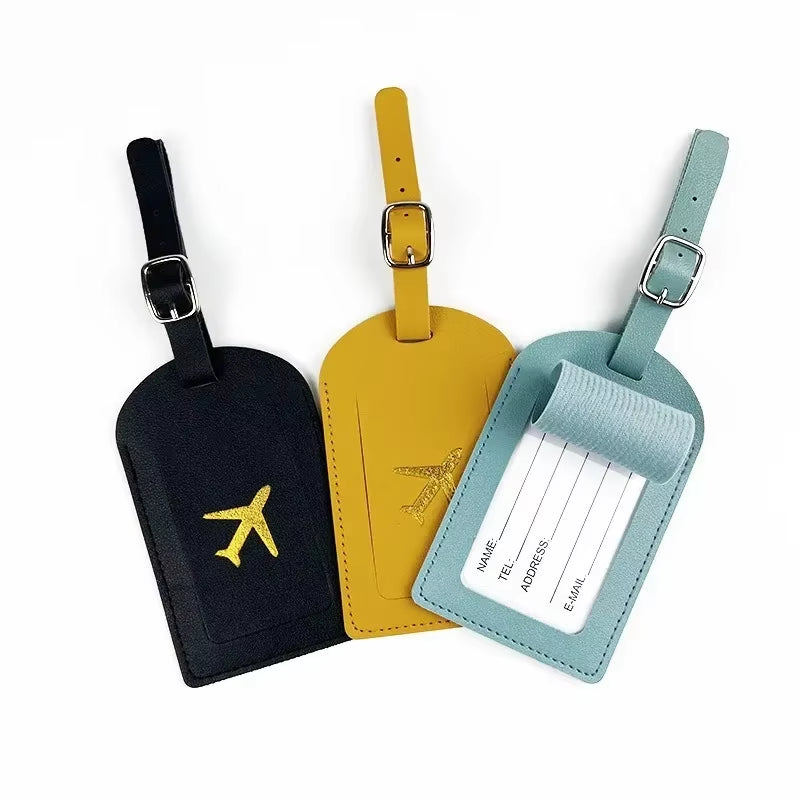 Stamped leather luggage tag | Engraved leather bag tag | Personalized leather travel tag | Genuine leather suitcase tag | Elegant leather luggage label | Leather luggage tag with buckle | Leather ID tag for suitcase | Luxury leather baggage tag | Leather name tag for luggage | Leather travel tag with ID window