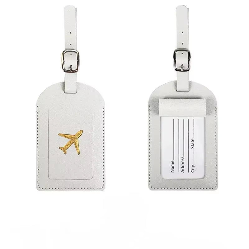 Stamped leather luggage tag | Engraved leather bag tag | Personalized leather travel tag | Genuine leather suitcase tag | Elegant leather luggage label | Leather luggage tag with buckle | Leather ID tag for suitcase | Luxury leather baggage tag | Leather name tag for luggage | Leather travel tag with ID window