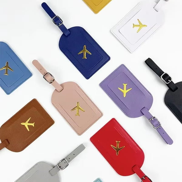 Stamped leather luggage tag | Engraved leather bag tag | Personalized leather travel tag | Genuine leather suitcase tag | Elegant leather luggage label | Leather luggage tag with buckle | Leather ID tag for suitcase | Luxury leather baggage tag | Leather name tag for luggage | Leather travel tag with ID window