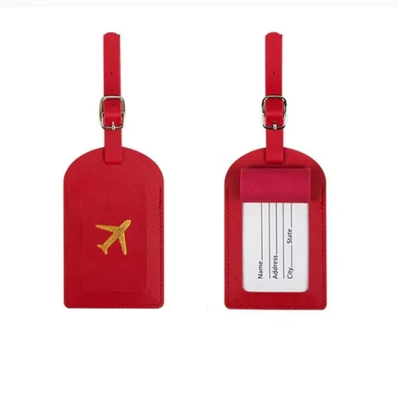 Stamped leather luggage tag | Engraved leather bag tag | Personalized leather travel tag | Genuine leather suitcase tag | Elegant leather luggage label | Leather luggage tag with buckle | Leather ID tag for suitcase | Luxury leather baggage tag | Leather name tag for luggage | Leather travel tag with ID window